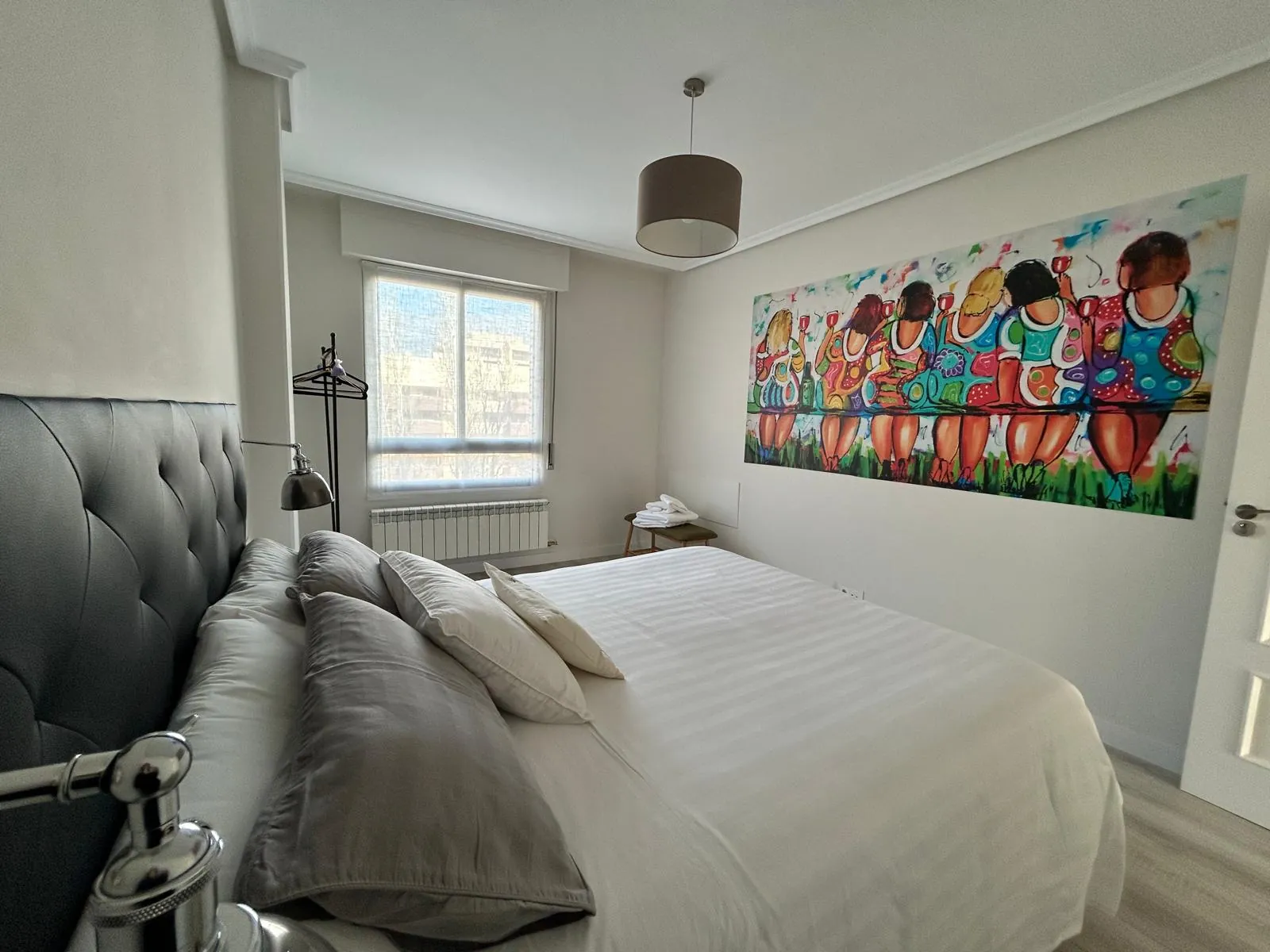 Bedroom II with a colourful painting