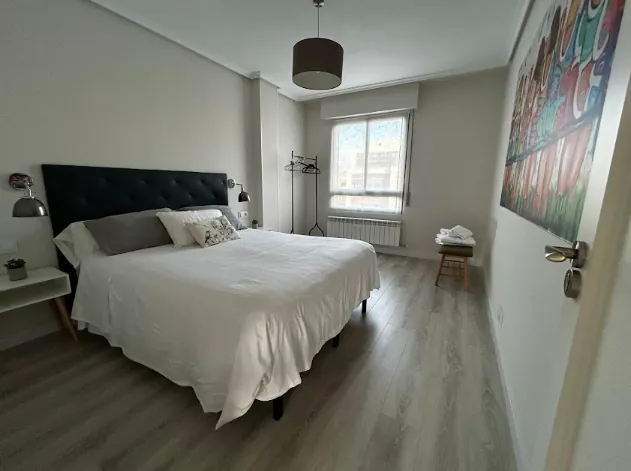Bedroom II with double bed and upholstered headboard