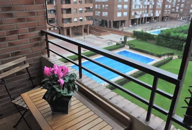 View from the terrace over the communal pool and garden